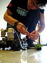 Robotics Team member Adam Steege '08 preps a robot to extinguish a flame.