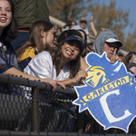 Fans cheer from the stands at the Carleton vs. St. Olaf Football Game