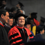 President Steven Poskanzer stands awaiting the Salutatory during Opening Convocation.