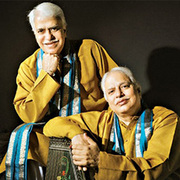 Portrait of Hindustani vocalists Pandits Rajan and Sajan Misra.