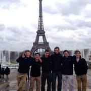 Men's soccer hanging out at the Eiffel Tower