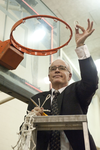 Carleton head coach Guy Kalland celebrates the Knights 2010-11 MIAC regular season title.