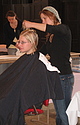 A Carleton student getting a haircut.