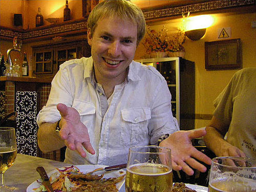 Sevilla: Niall Bachynski makes a funny face while gesturing fervently as we enjoy fine cuisine in Sevilla, Spain.