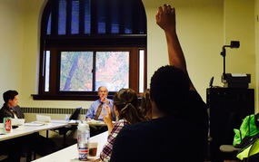 A student raises his hand in Clifford Clark's freshman history seminar.