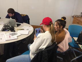 Image of students using the BiochemAR app in a biochemistry class.