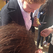 Claire multi-tasking--eating an apple AND signing autographs!