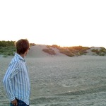 Charlie admires the setting sun on El Saler beach