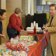 President Poskanzer purchases holiday treats at the 2018 custodial bake sale.