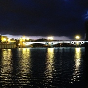 Triana Bridge light up at night