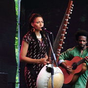Image of West African musician Sona Jobarteh performing.