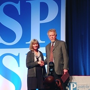 Image of professor Neil Lutsky receiving award.
