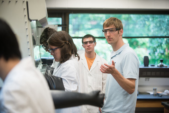 Matt Whited watches over students in the Carleton science research lab.